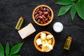 Beautiful composition with cocoa butter cosmetics. Cocoa butter and cocoa beans near homemade soap, cream, oil or lotion Royalty Free Stock Photo