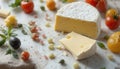 Fresh Artisan Cheese Surrounded by Colorful Cherry Tomatoes and Herbs on a Rustic Table Setting Royalty Free Stock Photo