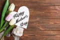 Beautiful composition with gift and handmade card for Mother's Day on wooden background Royalty Free Stock Photo