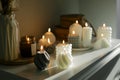 Beautiful composition with grey and white babble candles for spa treatment or home interior