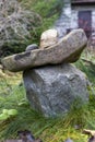 A beautiful composition of natural stones stacked together against a background of green grass Royalty Free Stock Photo