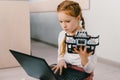 beautiful concentrated child programming diy robot, stem Royalty Free Stock Photo