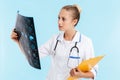 Beautiful blonde woman doctor wearing uniform standing Royalty Free Stock Photo