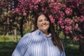 Beautiful and confident brunette smiling plus size model