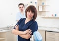 Beautiful and confident dentist woman and male assistant Royalty Free Stock Photo