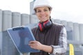 beautiful construction worker holding paper holder