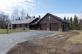 Beautiful contemporary rustic log cabin on a rural field in the mountains