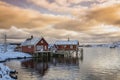 Beautiful contrasting red houses on the coast of the bay, winter sunrise Royalty Free Stock Photo