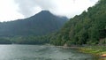 beautiful and cool sarangan lake surrounded by green forest Royalty Free Stock Photo