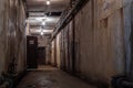 A beautiful corridor with shabby walls in an abandoned underground bunker. Old underground building. S Royalty Free Stock Photo