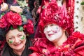 Costumed senior women with handmade dress full of roses and hearts at carnival in Zurich