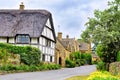 Beautiful Cotswolds village with half timbered thatched roof house, England Royalty Free Stock Photo