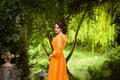 The beautiful countess in a long orange dress Royalty Free Stock Photo