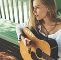 Beautiful country girl with her guitar Royalty Free Stock Photo