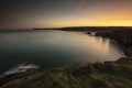 Beautiful country scenery of small hills surrounding the sea in Perran Sands, Cornwall, UK Royalty Free Stock Photo