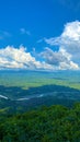 Sunny countryside springtime grassy landscape hills mountains. Green mountains & beautiful sky Royalty Free Stock Photo