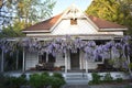 Beautiful countryside house with flowers hanging from the roof Royalty Free Stock Photo