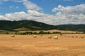 Beautiful countryside landscape. Hay bales in harvested fields Royalty Free Stock Photo