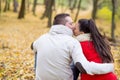 Beautiful couple in autumn park sitting on the ground Royalty Free Stock Photo