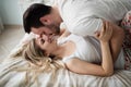 Beautiful couple being romantic and passionate in bed Royalty Free Stock Photo