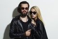 Beautiful couple in black leather wearing sunglasses and posing together Royalty Free Stock Photo
