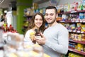 Beautiful couple buying convenience food