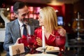 Beautiful couple celebrating anniversary at the restaurant Royalty Free Stock Photo