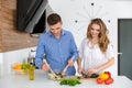 Beautiful couple cooking healthy food together Royalty Free Stock Photo