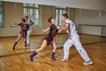 Beautiful couple dancing bachata in dance studio