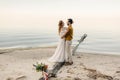 A beautiful couple is embracing on the sea background. Moment before the kiss. Romantic date on the beach. Wedding Royalty Free Stock Photo