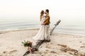 A beautiful couple is embracing on the sea background. Moment before the kiss. Romantic date on the beach. Wedding Royalty Free Stock Photo