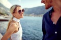 Beautiful couple flirting by sea. Woman with big smile looking at boyfriend. Love, summer holiday, togetherness concept Royalty Free Stock Photo