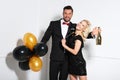 Party couple with balloons and champagne. Royalty Free Stock Photo