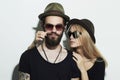 Beautiful couple in hat wearing trendy glasses together. Hipster boy and girl Royalty Free Stock Photo