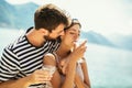 Couple having fun on the beach, drinking cocktails and smiling Royalty Free Stock Photo