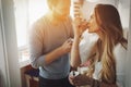 Couple having fun and laughing at home while eating ice cream Royalty Free Stock Photo