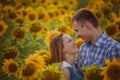 Beautiful couple having fun in sunflowers fields Royalty Free Stock Photo
