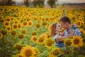 Beautiful couple having fun in sunflowers fields Royalty Free Stock Photo