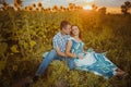 Beautiful couple having fun in sunflowers fields Royalty Free Stock Photo