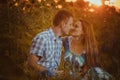 Beautiful couple having fun in sunflowers fields Royalty Free Stock Photo
