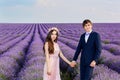 Beautiful couple kissing on nature in a yellow field of wheat in Royalty Free Stock Photo