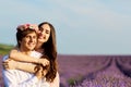 Beautiful couple kissing on nature in a yellow field of wheat in Royalty Free Stock Photo