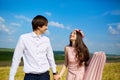 Beautiful couple kissing on nature in a yellow field of wheat in Royalty Free Stock Photo