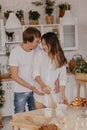 Beautiful couple in love celebreting Christmas. Kitchen breakfast - Image