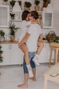 Beautiful couple in love celebreting Christmas. Kitchen breakfast - Image