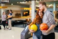 Cheerful friends bowling together and having fun Royalty Free Stock Photo