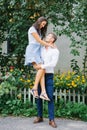 A beautiful couple in love, a guy and a girl, have fun free time. The guy picked up his favorite in his arms Royalty Free Stock Photo