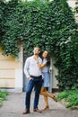 A beautiful couple in love, a guy and a girl, have fun free time, walking through the city streets in the summer Royalty Free Stock Photo