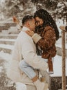 Beautiful Couple In Love kissing and laughing. Amazing winter holiday. Saint Valentine`s Day.