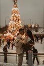 Young romantic couple in love outdoors in winter before Christmas. Two lovers are hugging and kissing in Saint Valentine`s Day. Royalty Free Stock Photo